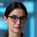 Professional headshot of Dr. Amelia Khan, Head of Research